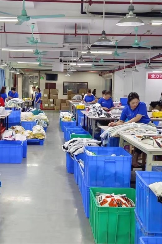 Manual Inspection of Finished Sports Bag, Quality Control Staff Checking Details Like Stitches and Accessories - Fmosbag - Custom Sports Bags (cycling/camping/fitness) - Fmosbag - Custom Sports Bags (cycling/camping/fitness)