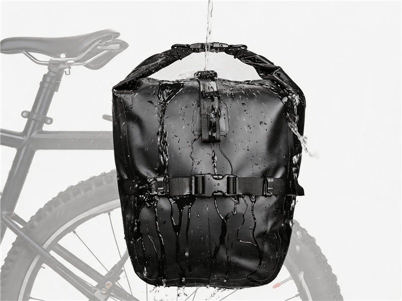Waterproof Black Bike Backpack Hanging, Water Droplets on Surface, with a Bicycle Tire and Frame in the Blurred Background.”] , - Fmosbag - Oem Bag Manufacturer & Custom Bag Factory - Fmosbag - Oem Bag Manufacturer & Custom Bag Factory