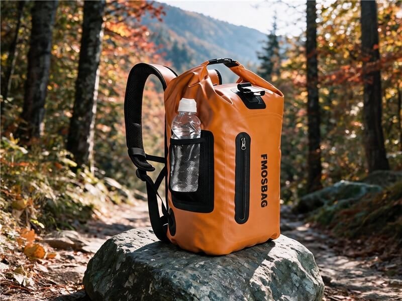 Heavy Duty Dry Duffel Bag — Roll Top Waterproof Camping Gear Bag - Fmosbag - Oem Bag Manufacturer & Custom Bag Factory - Fmosbag - Oem Bag Manufacturer & Custom Bag Factory Orange Heavy Duty Roll Top Waterproof Dry Duffel Bag on Rock in Autumn Forest - Fmosbag - Oem Bag Manufacturer & Custom Bag Factory - Fmosbag - Oem Bag Manufacturer & Custom Bag Factory