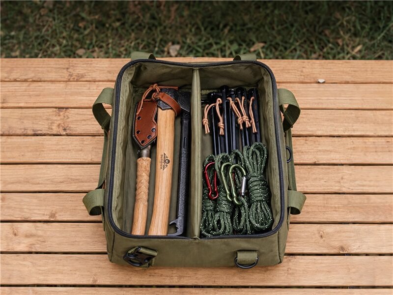 Custom Camping Tool Storage Bag - Fmosbag - Oem Bag Manufacturer & Custom Bag Factory - Fmosbag - Oem Bag Manufacturer & Custom Bag Factory Open Camping Tool Storage Bag with 1000d Cordura Nylon, Multiple Pockets and Tools Inside on Wooden Table - Fmosbag - Oem Bag Manufacturer & Custom Bag Factory - Fmosbag - Oem Bag Manufacturer & Custom Bag Factory
